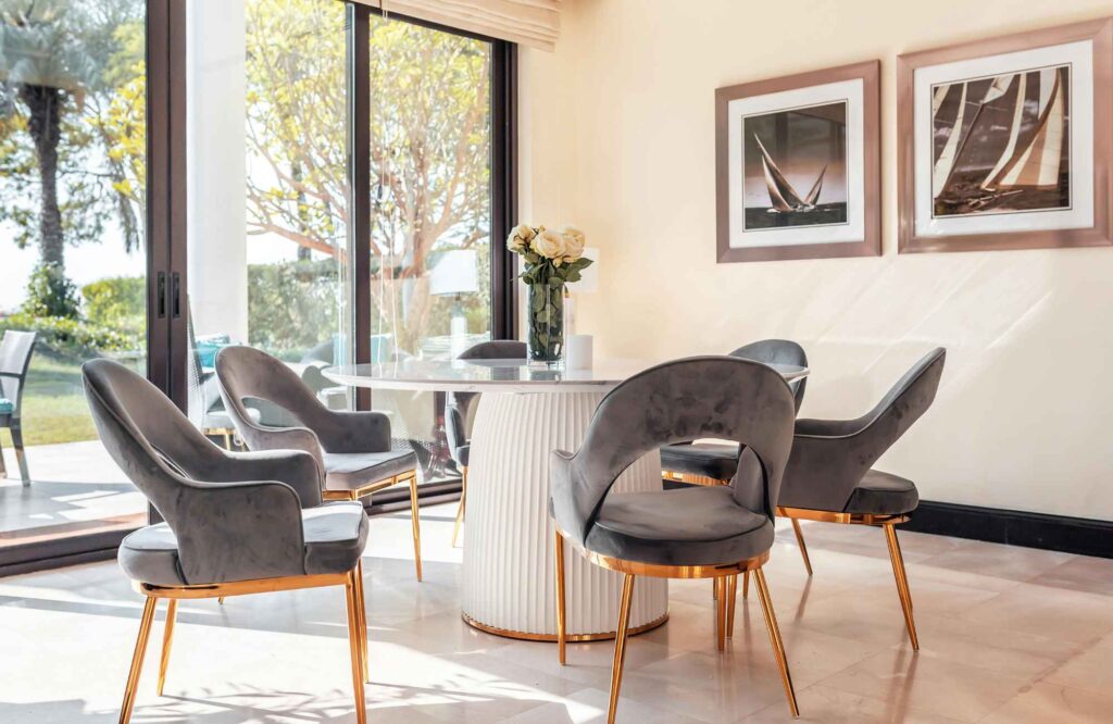 rooted-interior-design-maize-ks-designing-flexible-spaces-around-dining-table-upholstered-chairs-large-sliding-door-millwork-design