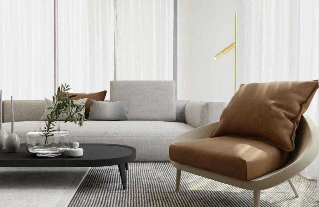 rooted-interior-design-eastborough-ks-scale-and-proportion-in-design-low-sofa-and-leather-chair-in-living-room-curated-virtual-interior-design