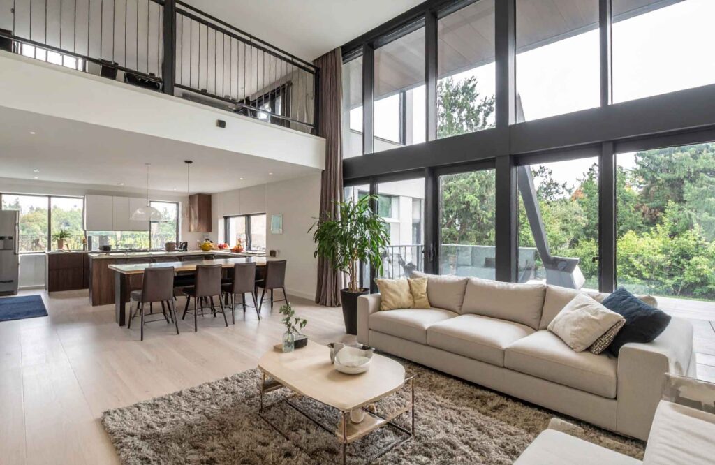 rooted-interior-design-wichita-ks-open-vs-closed-floor-plans-open-floor-plan-large-home-cathedral-ceiling-large-windows-contemporary-furnishings-curated