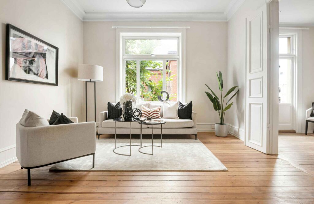 rooted-interior-design-wichita-ks-scale-and-proportion-in-design-living-room-with-neutral-colors-contemporary-furnishings-thoughtful-space-planning